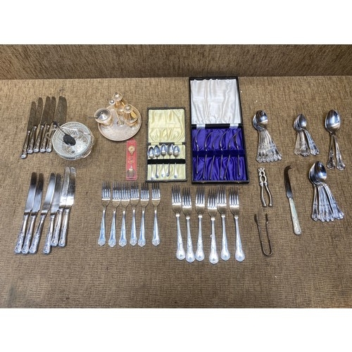 460 - A silver plated cruet set and a collection of boxed and un-boxed silver plated cutlery.