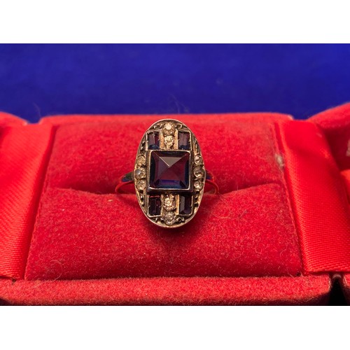 1048 - 9ct gold ring 2.3 grams size J with a dark blue stone.