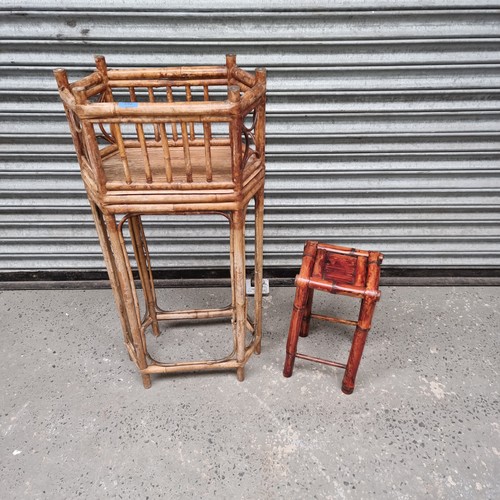 692 - Two antique cane built plant stands.