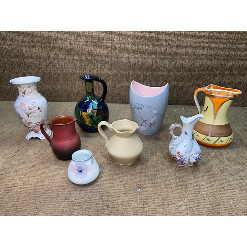 718 - 8 quality ceramic pottery jugs and vases including Wade , Walt Disney fantasia grey , Gowda and Myot... 