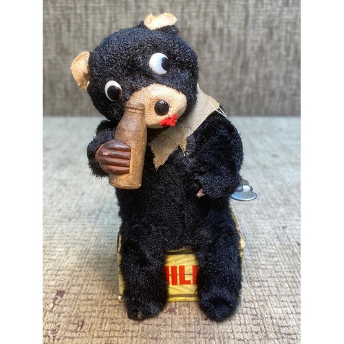 1254 - Antique Nomura Toy wind-up milk drinking bear with key.