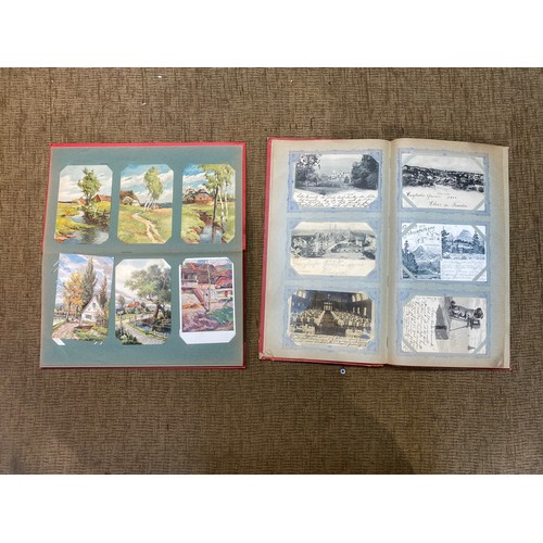 741 - Two antique postcard albums with approx. 140 German and Swiss postcards.