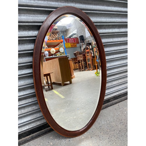 164 - Oval bevel edge mirror.