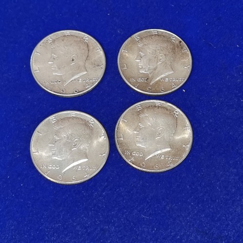 1066 - Four 900 silver 964 Kennedy Half Dollars.