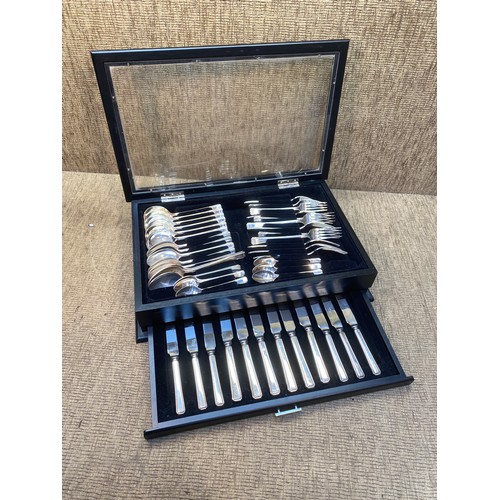 767 - Viners 44 piece cutlery set in a wooden glass fronted display case.