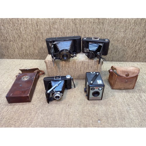 768 - Four vintage Kodak bellow cameras including the Kodak Junior.