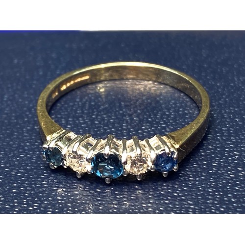 1076 - 9ct gold, diamonds and sapphire eternity ring. 2.3g. Size 9.