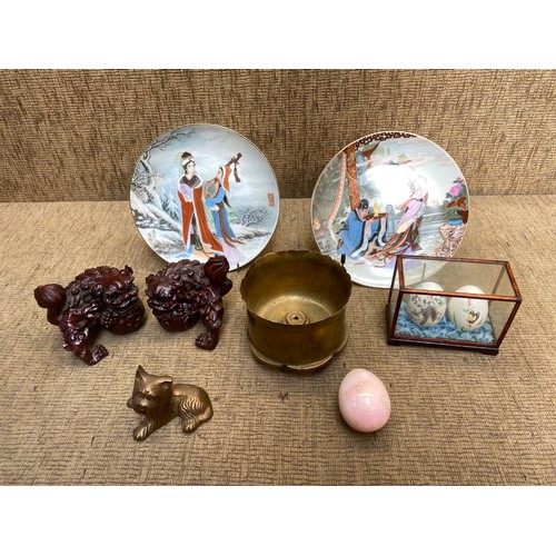 493 - Trench art, temple dogs and Japanese items including eggs.