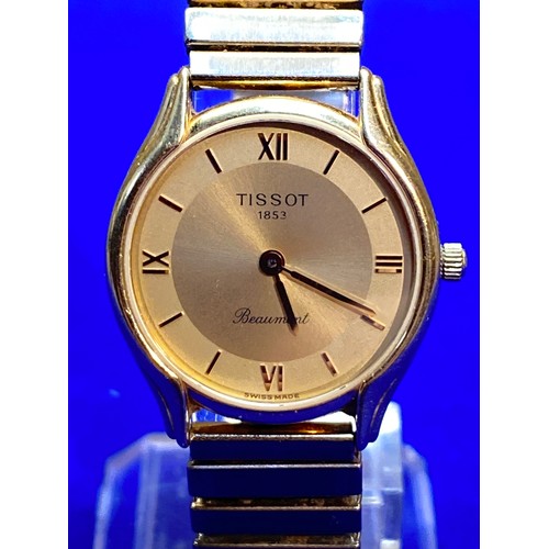 1089 - 18ct Gold ladies Beaumont watch by Tissot (strap is gold plate). Swiss hallmark, Chiasso.