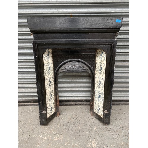 809 - Cast iron fire surround.