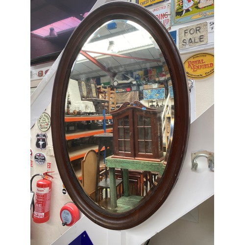 808 - Large oval rosewood mirror.