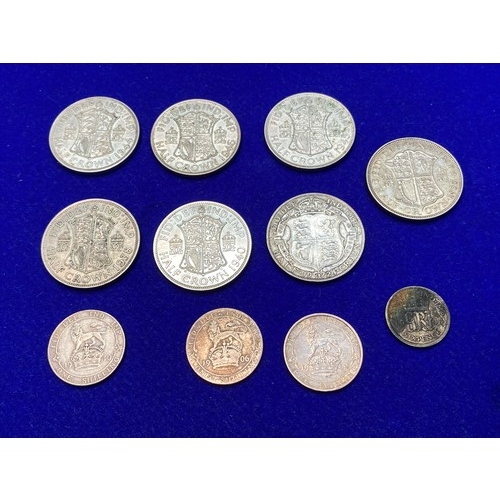 1098 - Seven half silver, half crowns and a six pence (1922-46, and three silver shillings (1902,06,10).