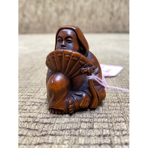 1118 - Signed Japanese Netsuke of a Lady .