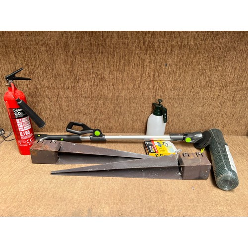 225 - Gtec strimmer (comes on, no charger) , fence post spikes and garden items.