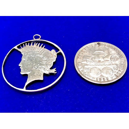 1432 - Silver 1983 half dollar and interesting 1922 silver peace dollar converted to a pendant.