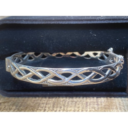 1434 - Celtic style silver bangle in a case