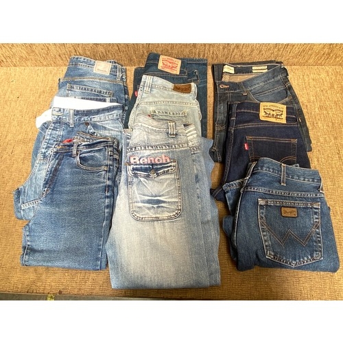 666 - 10 pairs of designer Jeans Various sizes including Levi Wrangler and Bench.