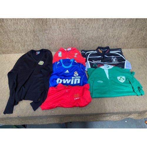 670 - 6 Rugby and football shirts including Ospreys, Ireland and Wales tops.