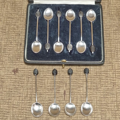 850 - Set of hallmark silver bean spoons and a set of unhallmarked silver spoons (one case)