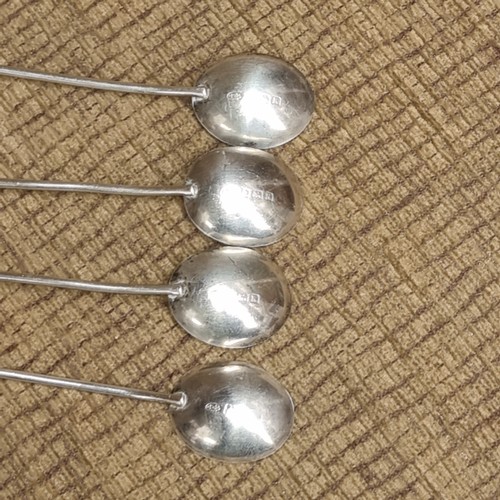 850 - Set of hallmark silver bean spoons and a set of unhallmarked silver spoons (one case)