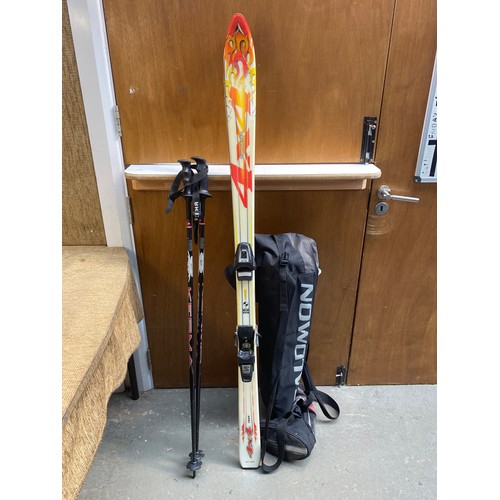 50 - Pair of Saloman 500 Dynastar Skis with poles and case.