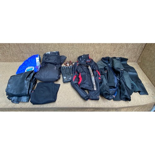 65 - Large quantity of Motorbike safety clothing including gloves, Jackets, trousers and safety goggles.