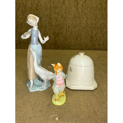 717 - Lladro figure of a lady with a duck, a Beswick honey pot and a Beswick Beatrix Potter figure.