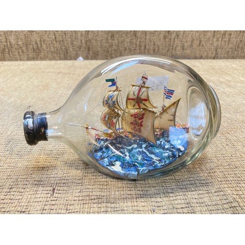 720 - vintage wooden ship in a glass bottle.