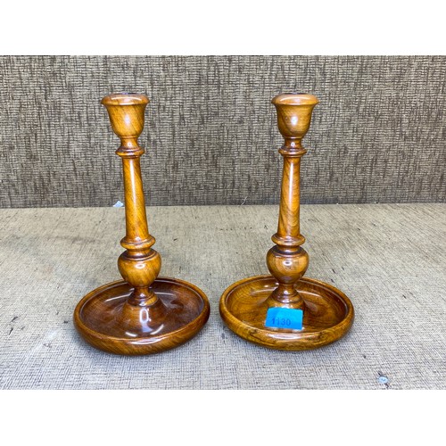 1130 - Pair of fruit wood pillar candle sticks.