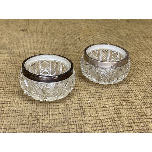 1142 - Two lead crystal bowls with silver rims hallmarked Birmingham.