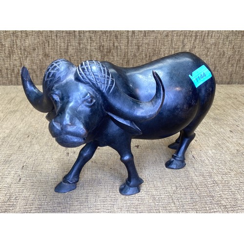 1144 - Ebonised carved buffalo 11