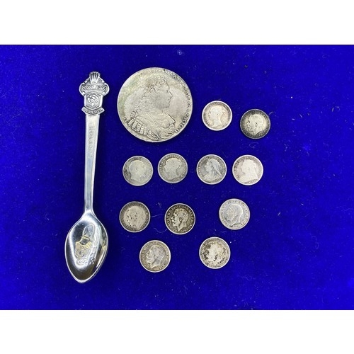 867 - 11 silver Three pences, a collectable Rolex Spoon and a Replica Russian Rouble.