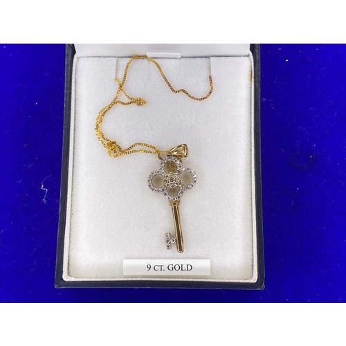 869 - 9ct gold 18 key pendant on 9ct gold chain 2.3g.