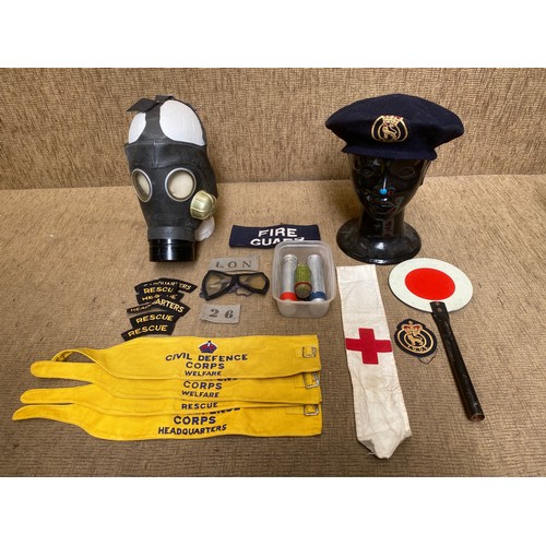 1150 - Civil Defence Corps items including Gas mask, arms bands and cold war dosimeters.