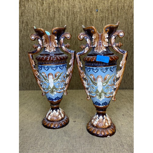 1195 - Pair of Majolica style vases 36cm tall one has restoration to the base.