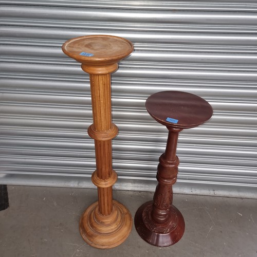 1221 - Two large solid wood tall standing plant stands.