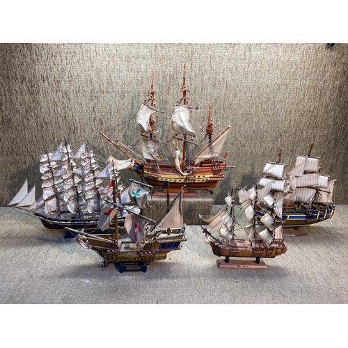 1215 - Five antique wooden model ships.