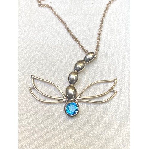 894 - Stirling silver, aqua marine pendant and chain in the shape of a dragon fly.