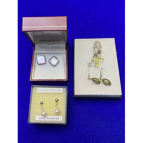 896 - Silver cross, chain and earrings, Sterling silver cufflinks with mother of pearl  and a pair of silv... 