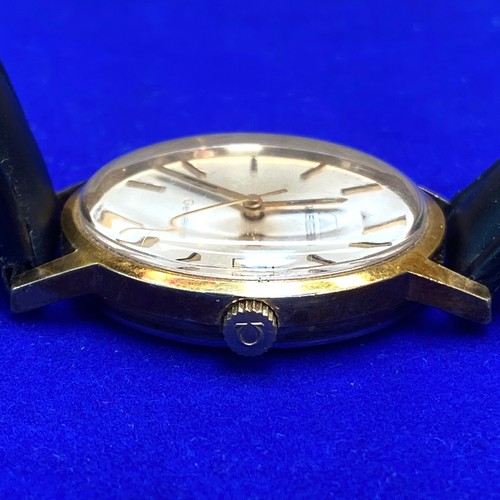 923 - Omega Genève gold plated hand wind dress watch 35mm case. Quickset Date.