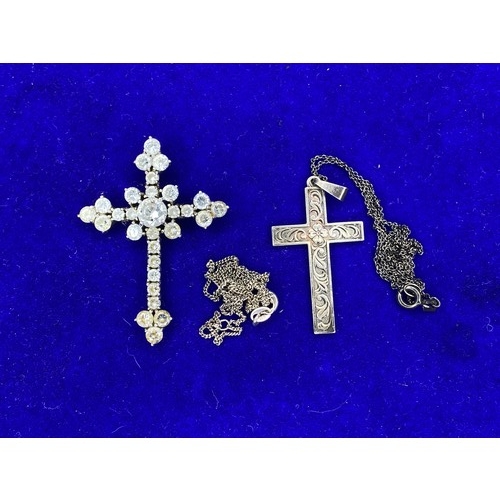 940 - Two silver necklaces one with a cross pendant all stamped 925 and a large silver cross pendant with ... 