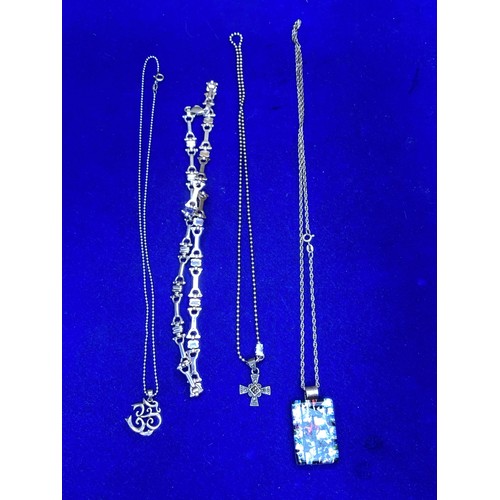 942 - Three heavy silver necklaces one with a large silver and glass pendant.