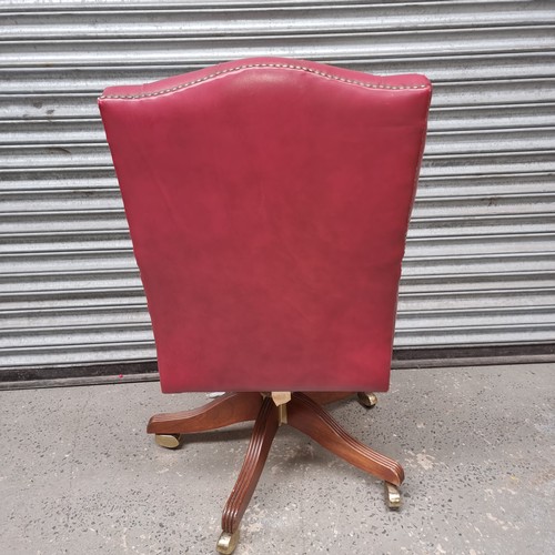 1331 - Leather upholstered captains chair.