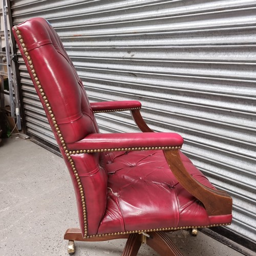 1331 - Leather upholstered captains chair.