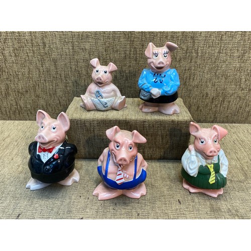 1063 - Five vintage Wade pig money boxes.