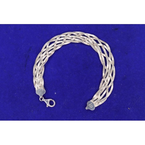852 - Silver crisscross bracelet stamped 925 Italy.