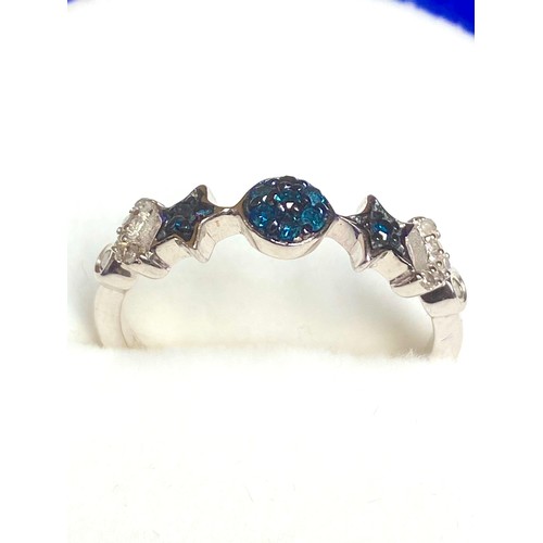 858 - Two silver rings one with blue star stones and one with clear CZ stones both stamped 925.