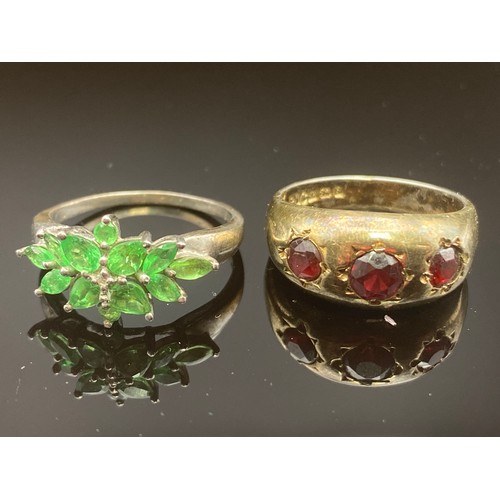 859 - Two vintage silver rings one with red stones and full Birmingham hallmarks, one with green stones st... 