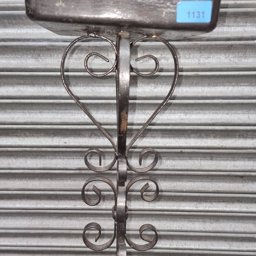 1131 - Wrought iron sculpted tall standing plant stand.