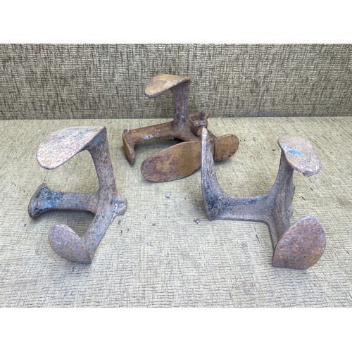 1124 - Three cast iron shoe lasts.